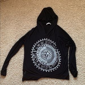 Black long sleeve with sun design.